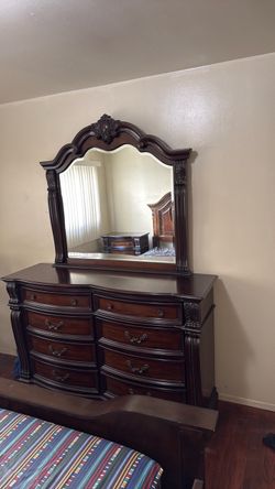 Dark Wood Dresser with Ornate Mirror