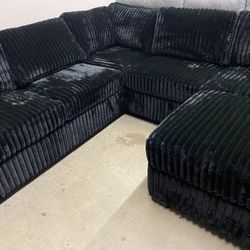Black Onyx Plush Corduroy Sectional with ottoman and accent pillows 99x99 