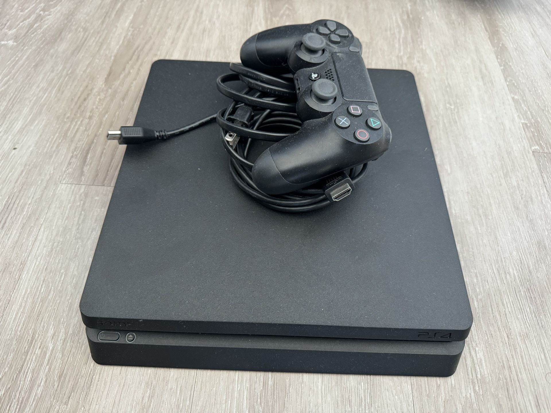 Excellent Condition PS4 with Controller and All Cables - Ready to Play!