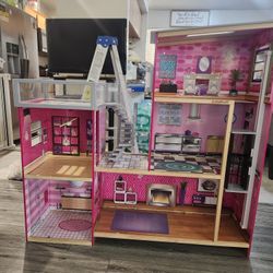 Barbie dollhouse comes with all the toys and they are in good condition.