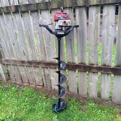 gas ice auger drill with 8" bit and its 53ins tall runs great