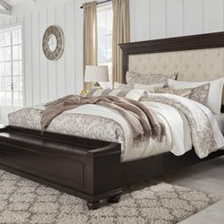 Brynhurst Dark Brown King Upholstered Storage Bed

