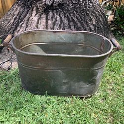 Preowned vintage copper bucket has small hole