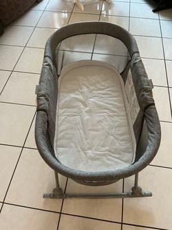 Swing-style bassinet with mattress; clean, from a smoke-free and pet-free home; very comfortable; measures 33" x 17".