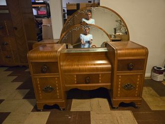 There is a dresser with mirror vanity with mirror and night stand all is excellent condition 2000 obo