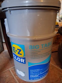 50-pound bucket of Shockwave Granular Pool Shock, which is a powerful chemical treatment used to clean and maintain swimming pools.
