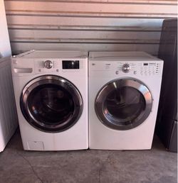 White Kenmore Washer And LG Electric Dryer