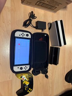 Nintendo switch OLED with docking station, HDMI, Pikachu controller, charger and 256 GB memory card no trades cash only see my other listings for more