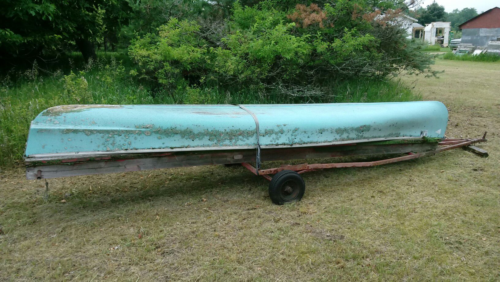 Photo 19 foot flat back canoe with trailer.