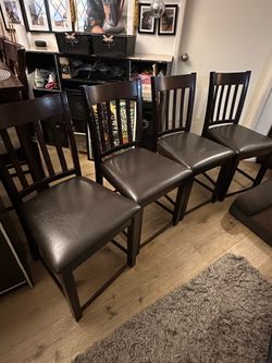 Set of four (4) espresso brown padded kitchen table chairs