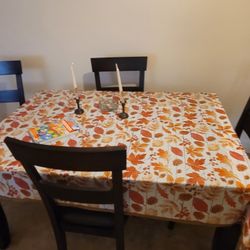 Dining Table and 4 cushioned chairs, Brown ,Good Condition
