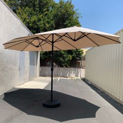 New in Box $130 Large Double Sided Outdoor (15ft Umbrella and 65lbs Plastic Base set) Beige color