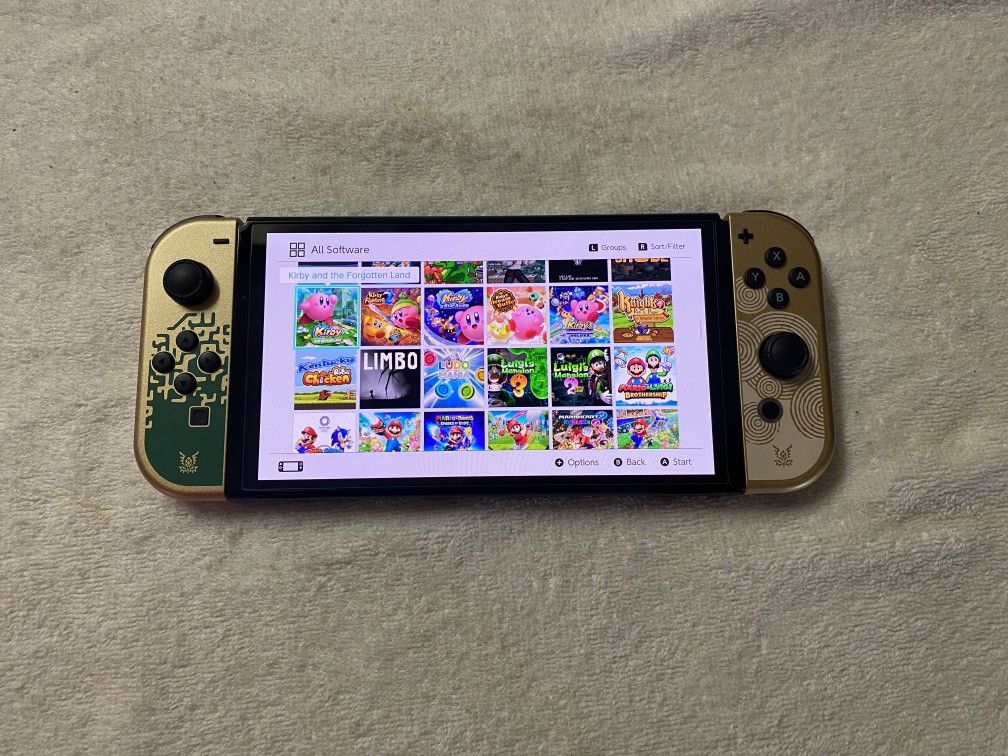 SWITCH OLED with 100 SWITCH GAMES MARIO KART,MARIO PARTY,ZELDA,POKEMON,GTA,MINECRAFT and More