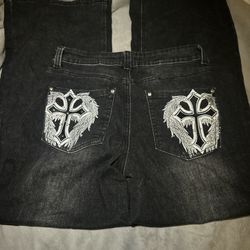 black denim jeans with white cross design 