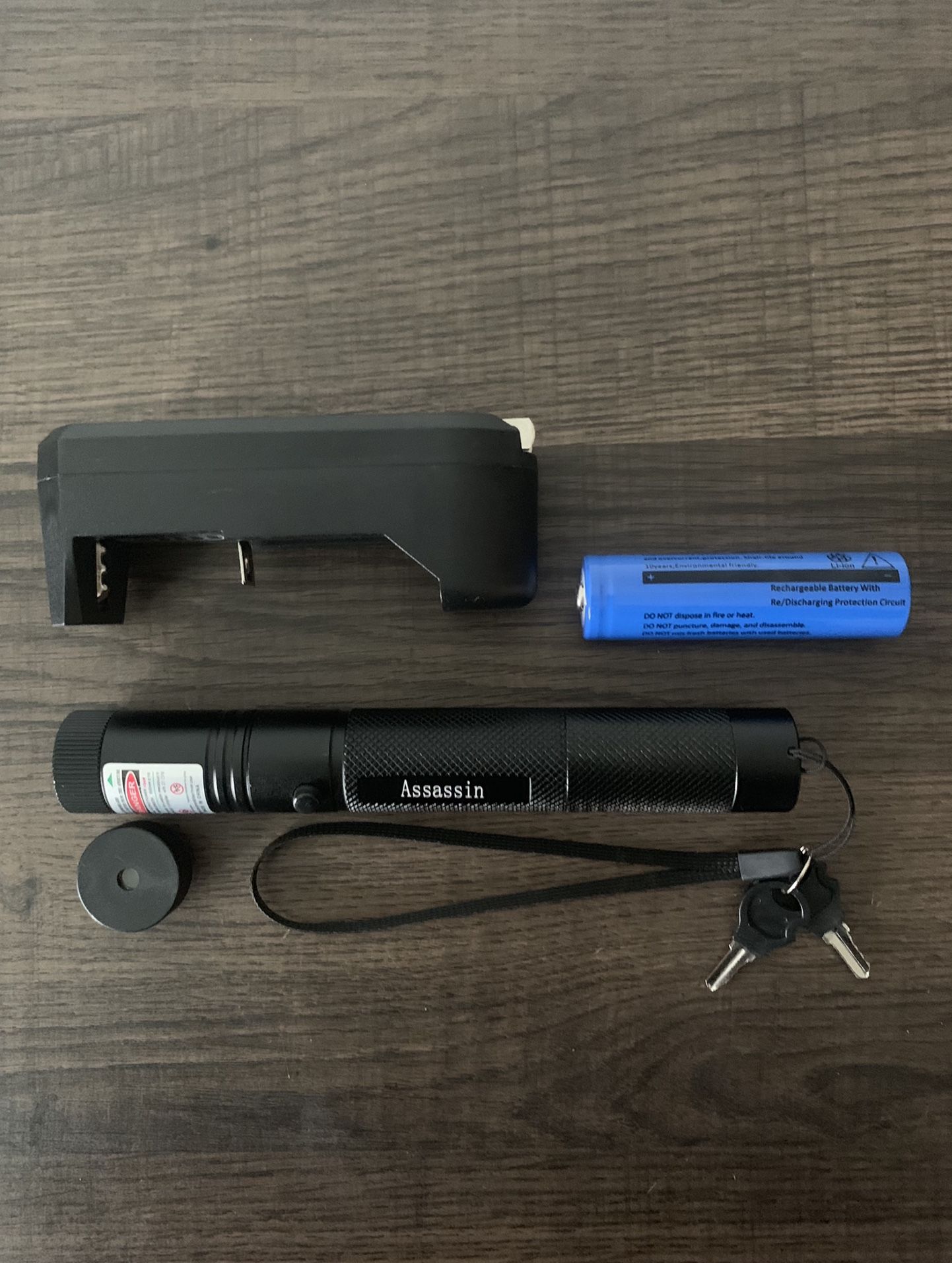Very Powerful Burning Green Laser Pointer with battery, charger, star cap, and safety keys feature