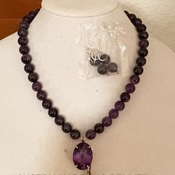 New, 20” SS 612.50TCW, 12mm Amethyst Bead Necklace with 47.51 Ct Amethyst Pendant and Matching Amethyst Bead Earrings.