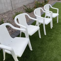 Four Plastic Patio Chairs