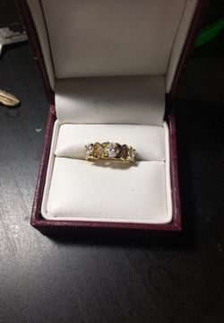 Gold plated xo ring with white Topaz stones