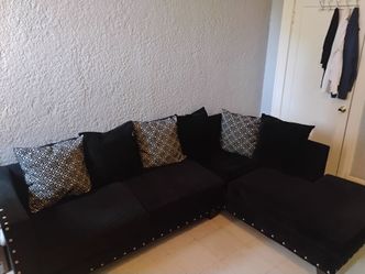 Black Sectional Sofa with Studded Trim