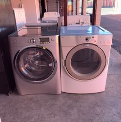 Gray Electrolux Washer And White Whirlpool Electric Dryer