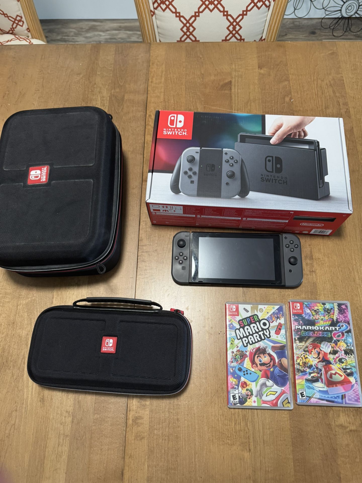 Nintendo Switch + 2 Cases + Mario Kart 8 + Super Mario Party