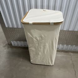 fabric laundry hamper with a bamboo frame and lid