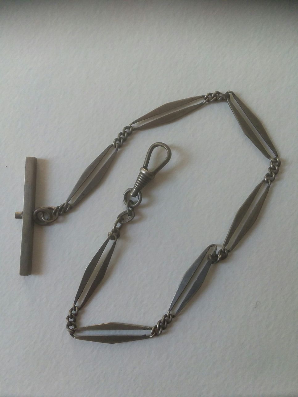 Antique pocket watch silver chain.