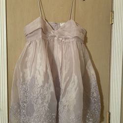Brand new adorable women’s size medium/large party dress.  Color is light lavender 