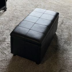 Black leather ottoman