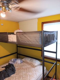 Metal frame twin bunkbed for sale.