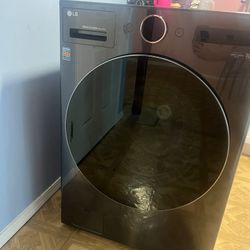 LG WM6700HBA 5.0 cubic feet front load black steel HE stackable smart washing machine