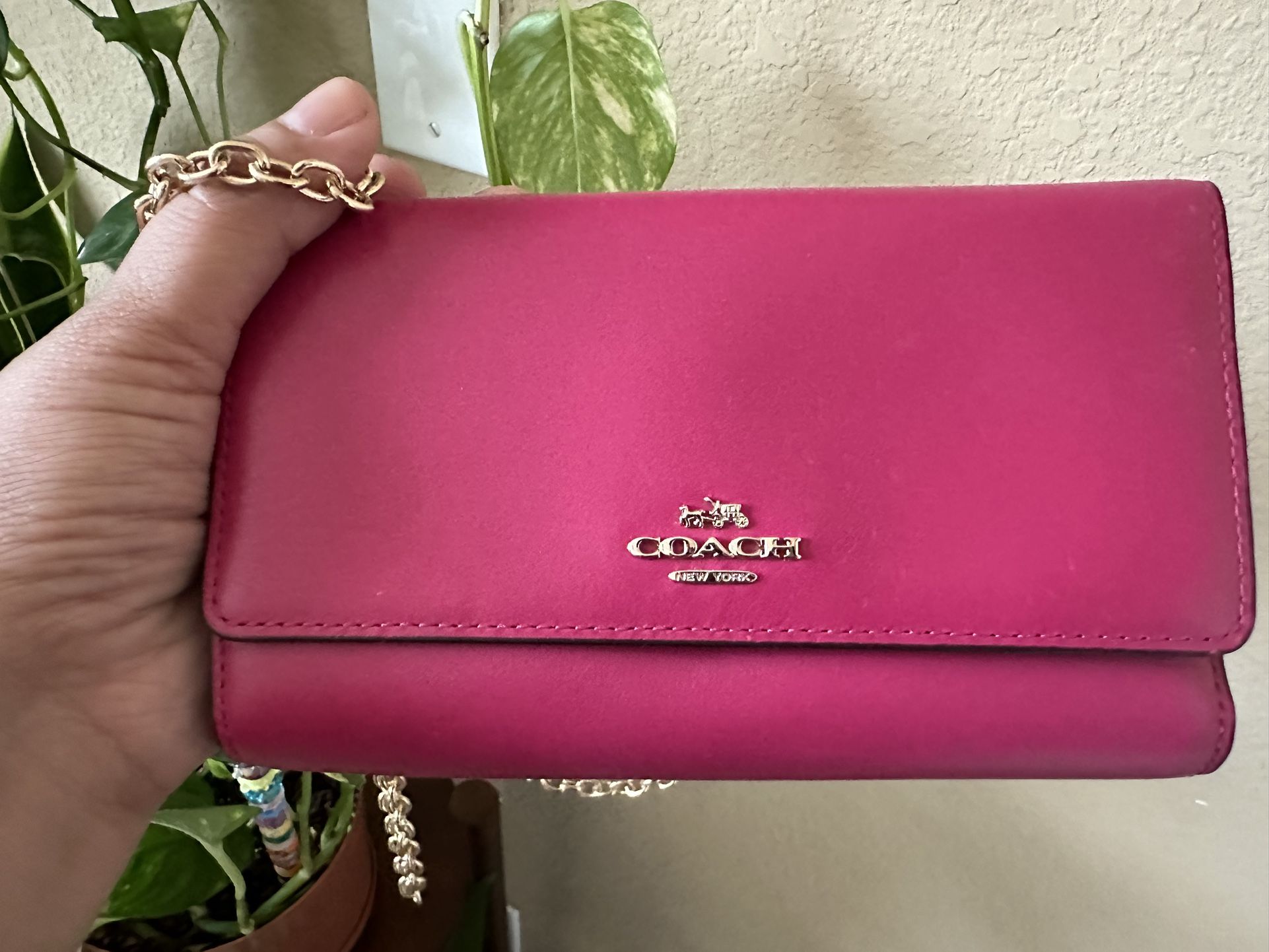 Pink Coach crossbody wallet