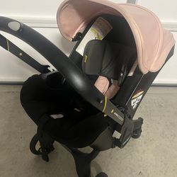 Doona Car Seat & Stroller + Base + 2 Bags (Good Used Condition)
