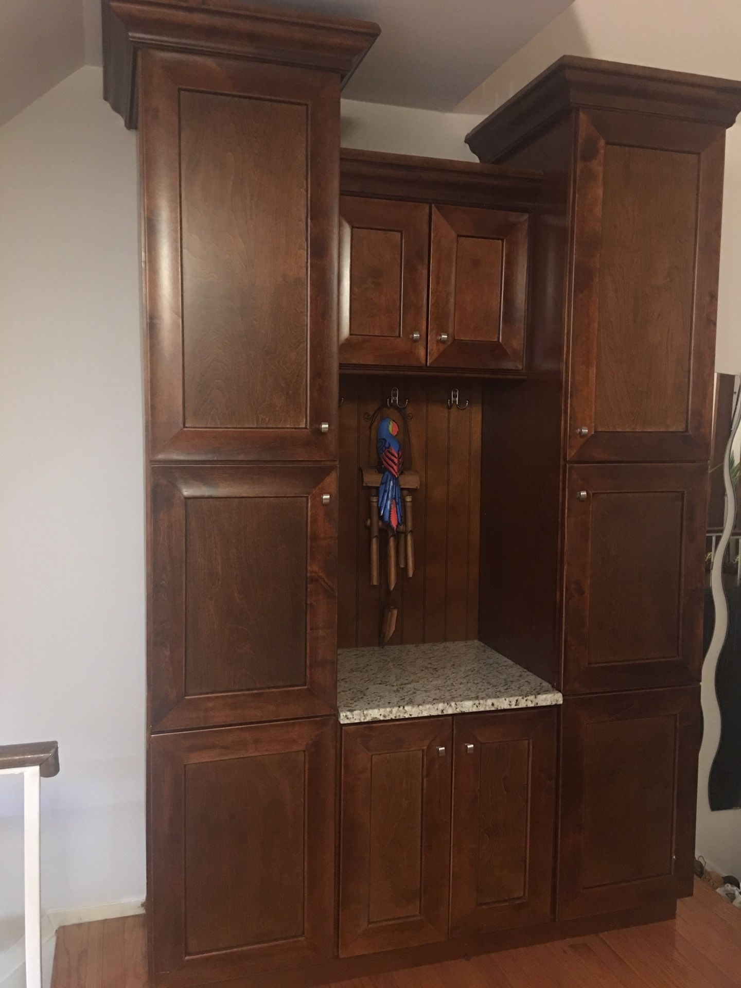 Mud room two pantry cabinets with granite counter top
