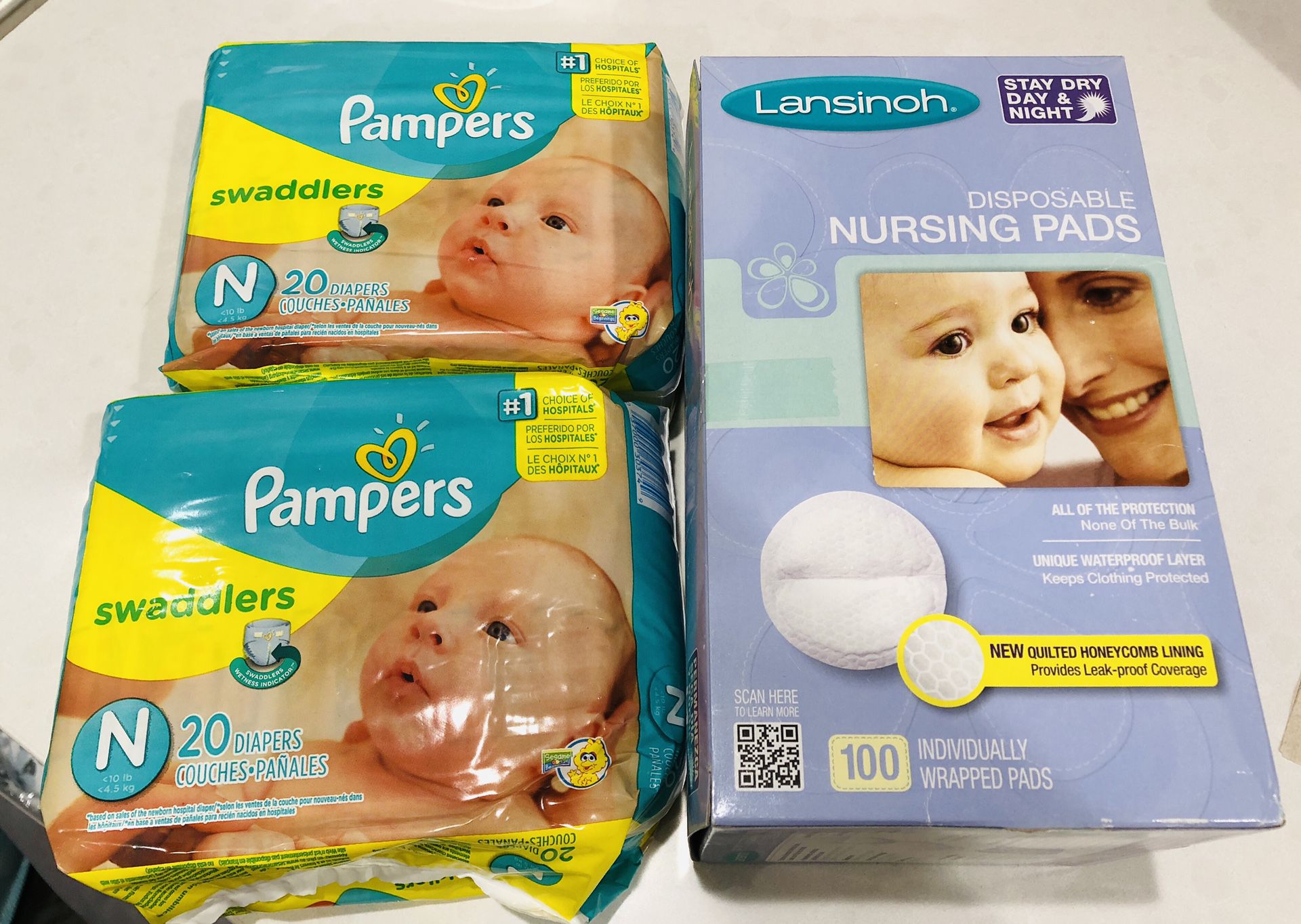 Pampers-newborn swaddlers & Lansinoh nursing pads-100
