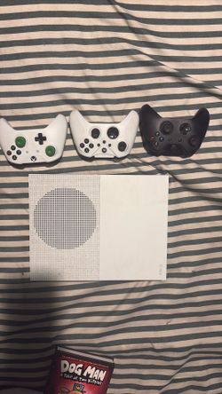 Xbox One with 3 controllers and headphones