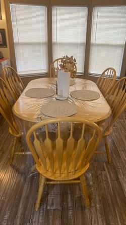Brown table 6 chairs  gets bigger