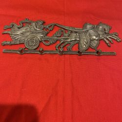 Vintage Metal  Wall Mounted Key Holder Featuring A Horse Drawn Carriage Design 