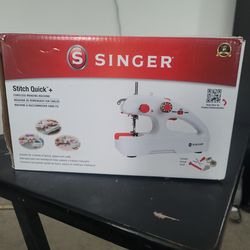 SINGER hand held sewing machine