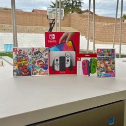 Nintendo switch Oled with extra controller and 3 Mario games 