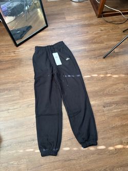 Alo sets in gray , navy blue, and black