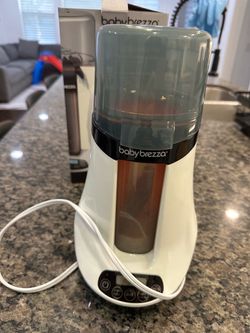 Milk bottle warmer and diaper wipes warmer