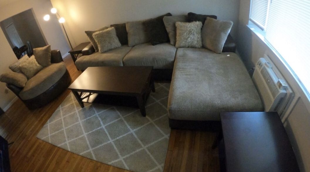 Brand new sectional, ottoman, coffee table and 2 end tables