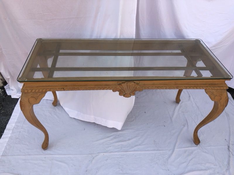 Glass topped wooden antique table