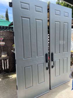 Entrance Front double door solid - with frame / keys - 95 each long / 36 inches each door . Light gray color is exterior and white is interior of the 