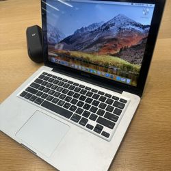 Apple Mac Book, 2 Pairs Of Apple Airpods, And Car Floor Jack