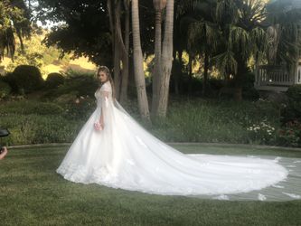 THIS CAN BE YOURS! Massive 9’ train, cape sleeves wedding dress.