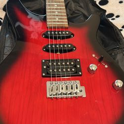 2 Electric Guitars Brand (Rogue Rocketeer)-(fender) Very Good Condition Only A Few Months Of Use On Both