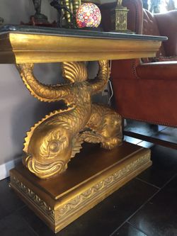 Gold guilt with black stone top