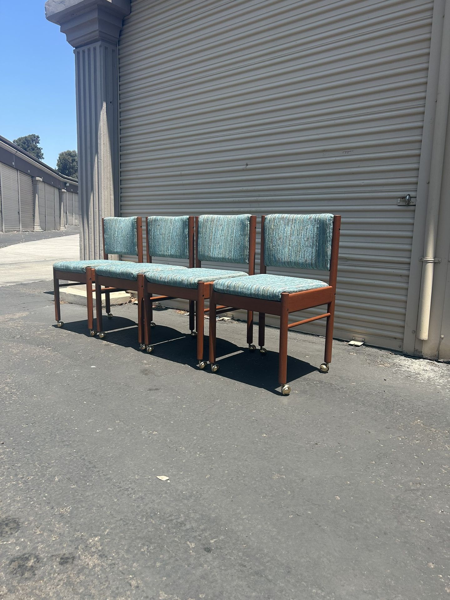 Mid Century Modern Teak Dining Rolling Chairs.